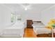 Bedroom with two beds, a dresser, wood floors, and a ceiling fan at 13521 Michael Lynn Rd, Charlotte, NC 28278