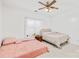 Bright bedroom with two beds, a ceiling fan, and neutral decor at 13521 Michael Lynn Rd, Charlotte, NC 28278