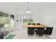 Bright dining room features large windows, glass doors, and table with black velvet chairs at 13521 Michael Lynn Rd, Charlotte, NC 28278