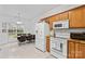 Bright kitchen features a range oven, microwave, and a dining table with modern black chairs at 13521 Michael Lynn Rd, Charlotte, NC 28278