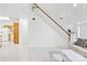 Bright, open-concept space with staircase and living room area at 13521 Michael Lynn Rd, Charlotte, NC 28278