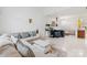 Bright living room featuring a large sofa, fireplace, and open layout, perfect for gatherings at 13521 Michael Lynn Rd, Charlotte, NC 28278