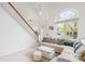 Bright living room with a large arched window, white walls, and a comfortable sectional sofa at 13521 Michael Lynn Rd, Charlotte, NC 28278