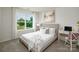 Comfortable bedroom with carpet flooring, natural light, and a stylish desk at 140 Falling Up Ln, Salisbury, NC 28147