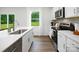 Modern kitchen with sleek countertops, stainless steel appliances, and ample natural light at 140 Falling Up Ln, Salisbury, NC 28147
