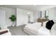 Bright bedroom with carpet flooring, large windows, and stylish furnishings at 140 Falling Up Ln, Salisbury, NC 28147