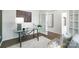 Cozy office showcasing a glass desk, modern chairs, and French doors with natural light at 140 Falling Up Ln, Salisbury, NC 28147
