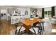 Open concept space with a dining table, counter seating, and views into the living room at 146 Falling Up Ln, Salisbury, NC 28147