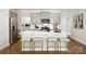 Modern kitchen with a white island, stainless steel appliances, gray cabinets, and stylish bar stools at 146 Falling Up Ln, Salisbury, NC 28147
