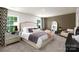 Serene main bedroom with plush bedding, mirrored dresser, and elegant decor for a relaxing retreat at 146 Falling Up Ln, Salisbury, NC 28147