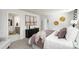Spacious main bedroom with a large bed, dresser, and ensuite bathroom entrance with modern décor at 146 Falling Up Ln, Salisbury, NC 28147
