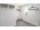 Well-organized walk-in closet with shelving, hanging space, and a cozy ottoman for added convenience at 146 Falling Up Ln, Salisbury, NC 28147