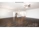 Open-concept living space with modern kitchen and hardwood floors, filled with natural light at 152 Falling Up Ln, Salisbury, NC 28147