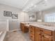 Bright bathroom featuring double sinks, a large mirror and tile backsplash at 153 Stafford Estates Dr, Salisbury, NC 28146