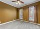 Bedroom with warm tones, carpet, and windows with privacy curtains at 153 Stafford Estates Dr, Salisbury, NC 28146