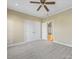 Bedroom featuring carpet, a double closet and a door leading to the hallway at 153 Stafford Estates Dr, Salisbury, NC 28146