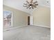Spacious bedroom with vaulted ceiling, fan, and large window offering natural light at 153 Stafford Estates Dr, Salisbury, NC 28146