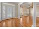 Elegant dining room showcasing hardwood floors, detailed trim work, chandelier and natural light at 153 Stafford Estates Dr, Salisbury, NC 28146