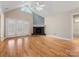 Living room featuring hardwood floors, a fireplace, and french doors at 153 Stafford Estates Dr, Salisbury, NC 28146