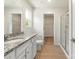 Bathroom with granite vanity, glass-enclosed shower, and an attached closet with wire shelving at 1530 Doran Ter, Richburg, SC 29729