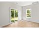 Bright bedroom with sliding glass doors, light wood floors, and views of the green backyard at 1530 Doran Ter, Richburg, SC 29729