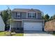 Charming two-story home featuring a two-car garage and a neatly landscaped front yard at 1530 Doran Ter, Richburg, SC 29729