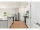 Well-lit kitchen featuring granite counters, stainless steel appliances and white cabinets at 1530 Doran Ter, Richburg, SC 29729