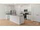 Modern kitchen with granite countertops, stainless steel appliances, and white cabinetry at 1530 Doran Ter, Richburg, SC 29729