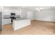 Bright, open-concept kitchen and living space with light wood flooring and modern appliances at 1530 Doran Ter, Richburg, SC 29729