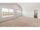 Spacious bedroom with carpet, vaulted ceiling, a bathroom, and large windows offering ample natural light at 1564 Doran Ter, Richburg, SC 29729