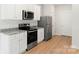 Kitchen featuring stainless steel appliances, white cabinets, and granite countertop at 1564 Doran Ter, Richburg, SC 29729