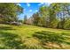 Large, grassy backyard with wooded boundary at 1725 Bristol Rd, Statesville, NC 28677