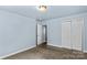 A spacious bedroom with a large closet and access to another room at 1725 Bristol Rd, Statesville, NC 28677