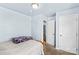 A bedroom with light blue walls, a window, and a closet at 1725 Bristol Rd, Statesville, NC 28677