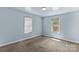 A bedroom with two windows and light blue walls at 1725 Bristol Rd, Statesville, NC 28677