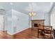 Dining area with wood floors, a stone fireplace, and elegant chandelier at 1725 Bristol Rd, Statesville, NC 28677