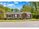 Charming single-story home with gray siding, red shutters, manicured lawn, and inviting front porch at 1725 Bristol Rd, Statesville, NC 28677