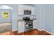 A kitchen showcasing stainless steel oven, white cabinetry, and a wood floor at 1725 Bristol Rd, Statesville, NC 28677