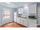 Functional kitchen with white cabinets, granite countertops, stainless steel sink and modern appliances at 1725 Bristol Rd, Statesville, NC 28677