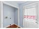 The laundry room has a white door with a window and a space for washer and dryer hookups at 1725 Bristol Rd, Statesville, NC 28677