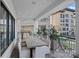 Enjoy outdoor living on this expansive balcony with comfortable seating and dining space at 19329 Watermark Dr # 531, Cornelius, NC 28031