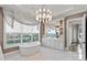 Bathroom with standalone tub, dual sinks, decorative mirror, and large window for natural light and beautiful views at 19329 Watermark Dr # 531, Cornelius, NC 28031