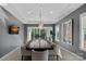 Elegant dining room with a large table, stylish chairs, and natural light at 19329 Watermark Dr # 531, Cornelius, NC 28031