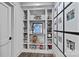 Hallway with built-in bookshelves displaying decor and photos, adding character and storage space at 19329 Watermark Dr # 531, Cornelius, NC 28031