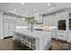 Gourmet kitchen with marble island, counter seating and modern pendant lighting at 19329 Watermark Dr # 531, Cornelius, NC 28031