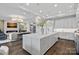 Open concept kitchen with marble island, stainless appliances and modern lighting fixtures at 19329 Watermark Dr # 531, Cornelius, NC 28031
