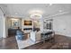 Bright living room with fireplace, luxury furniture and decor, neutral color palette at 19329 Watermark Dr # 531, Cornelius, NC 28031