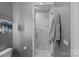Elegant bathroom features a marble tiled shower, a built-in shower niche, and modern fixtures at 19329 Watermark Dr # 531, Cornelius, NC 28031