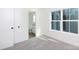 A cozy bedroom with an ensuite bathroom and light gray carpet at 202 Westerwood Dr, Rock Hill, SC 29732