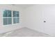 A well lit bedroom with a large window and neutral colored carpet flooring at 202 Westerwood Dr, Rock Hill, SC 29732